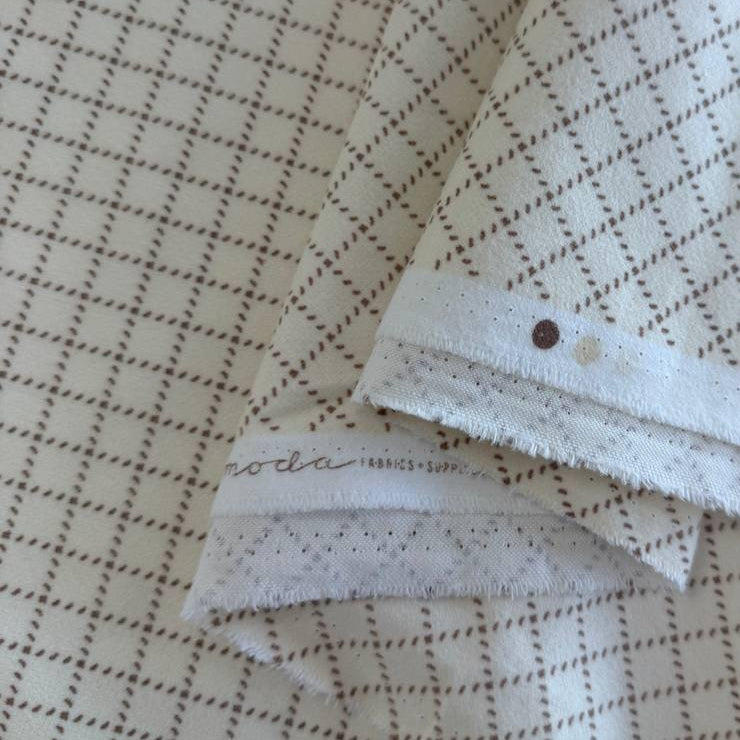 Prairie Gatherings cotton flannel fabric by Primitive Gatherings for Moda Fabrics featuring a small diamond geometric print, available in warm neutral and blue color variations.