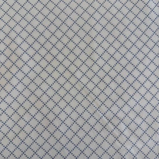Prairie Gatherings cotton flannel fabric by Primitive Gatherings for Moda Fabrics featuring a small diamond geometric print, available in warm neutral and blue color variations.