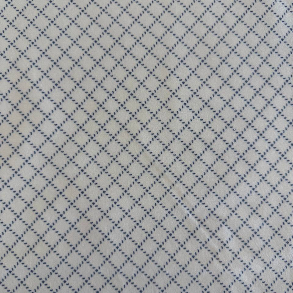 Prairie Gatherings cotton flannel fabric by Primitive Gatherings for Moda Fabrics featuring a small diamond geometric print, available in warm neutral and blue color variations.