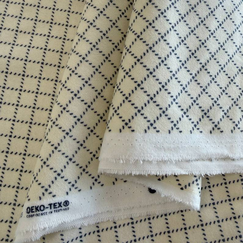 Prairie Gatherings cotton flannel fabric by Primitive Gatherings for Moda Fabrics featuring a small diamond geometric print, available in warm neutral and blue color variations.