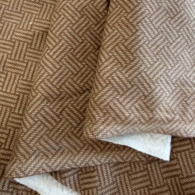Prairie Gatherings 108 inch cotton flannel fabric by Primitive Gatherings for Moda Fabrics featuring a woven-style geometric print, available in warm tan and soft grey color variations.