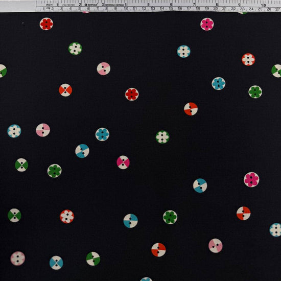 Moda 1800 Notion RS5208-17 Soft Black 100% cotton fabric by Ruby Star Society featuring colorful small button and floral motifs on a black background.