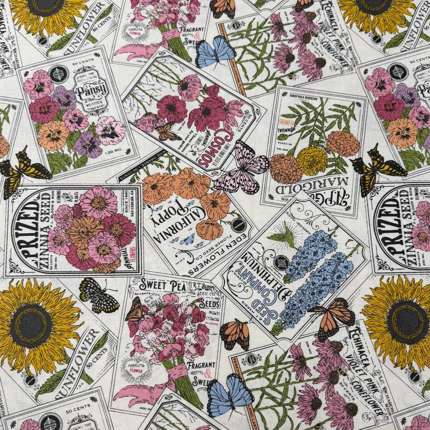 My Secret Garden by Stacy Iest Hsu for Moda 520981-11 Cloud 100% cotton fabric featuring vintage flower seed packets, colorful flowers, sunflowers and butterflies.