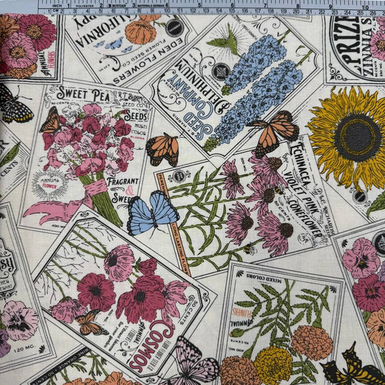 My Secret Garden by Stacy Iest Hsu for Moda 520981-11 Cloud 100% cotton fabric featuring vintage flower seed packets, colorful flowers, sunflowers and butterflies.