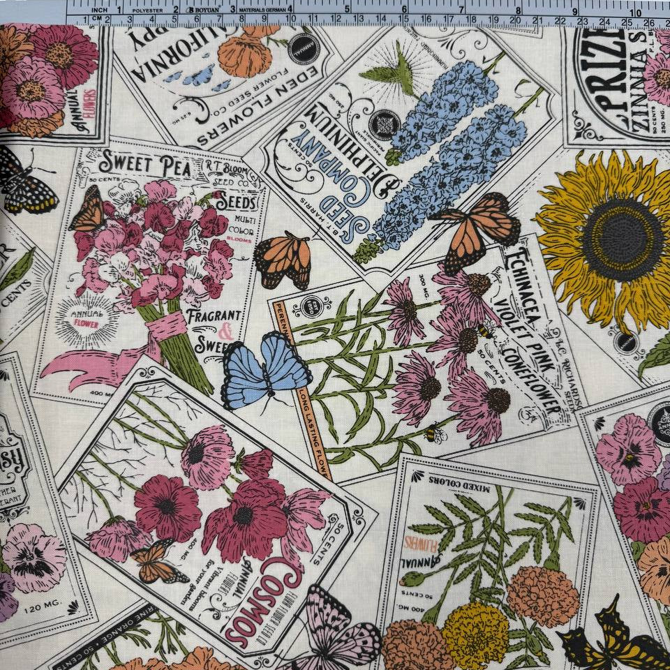 My Secret Garden by Stacy Iest Hsu for Moda 520981-11 Cloud 100% cotton fabric featuring vintage flower seed packets, colorful flowers, sunflowers and butterflies.