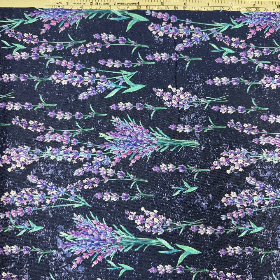 Lilac Lavender by STOF 100% cotton fabric with purple and lilac lavender flowers and green leaves on a deep navy blue background.