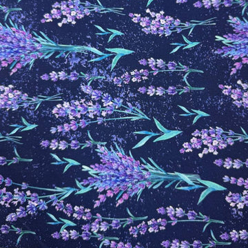 Lilac Lavender by STOF 100% cotton fabric with purple and lilac lavender flowers and green leaves on a deep navy blue background.