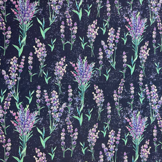 Lilac Lavender by STOF 100% cotton fabric with purple and lilac lavender flowers and green leaves on a deep navy blue background.