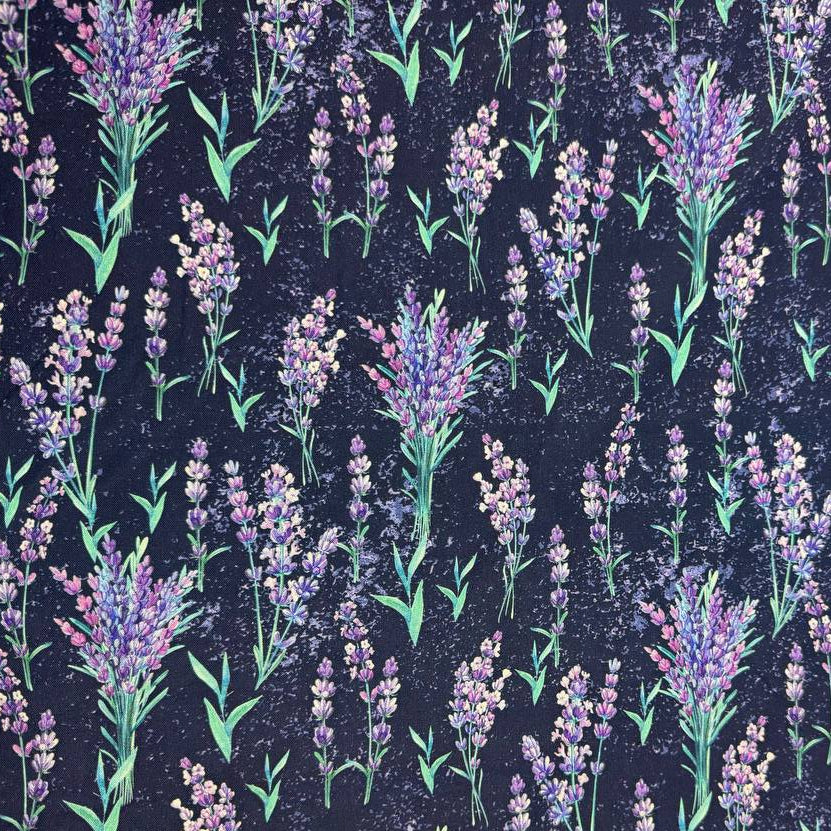 Lilac Lavender by STOF 100% cotton fabric with purple and lilac lavender flowers and green leaves on a deep navy blue background.