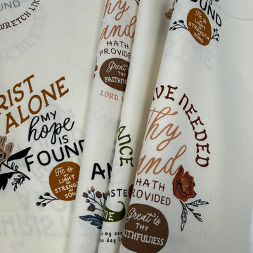 Wellspring by Fancy That Design House for Moda 100% cotton fabric with Christian inspirational and hymn phrases, floral accents and multicolor typography on a cream background.