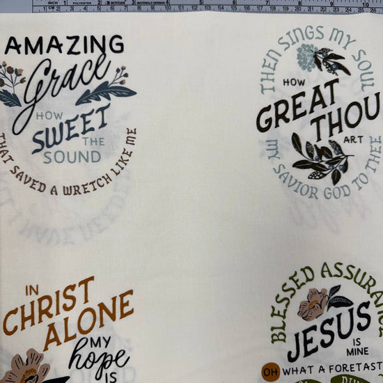 Wellspring by Fancy That Design House for Moda 100% cotton fabric with Christian inspirational and hymn phrases, floral accents and multicolor typography on a cream background.