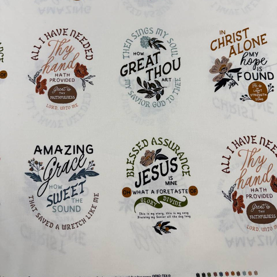 Wellspring by Fancy That Design House for Moda 100% cotton fabric with Christian inspirational and hymn phrases, floral accents and multicolor typography on a cream background.