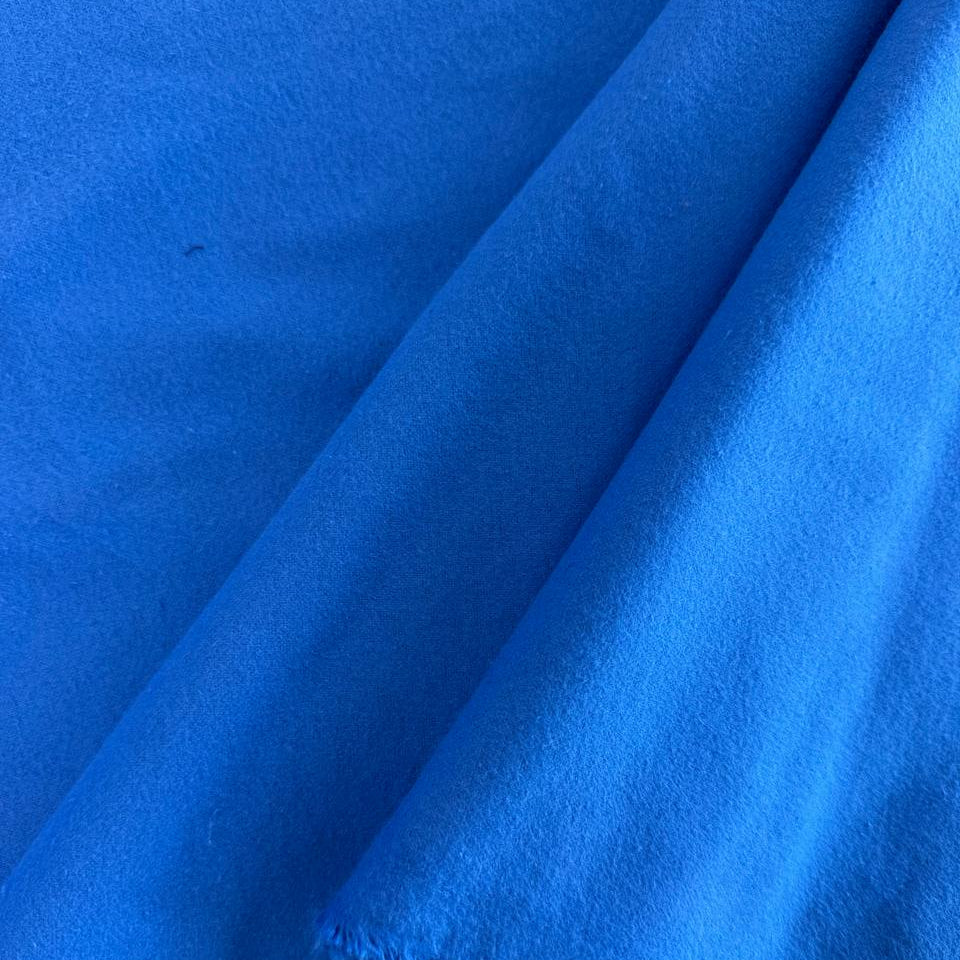 Soft 100% cotton flannelette fabric available in five solid colors: royal blue, pink, grey, mint, and white
