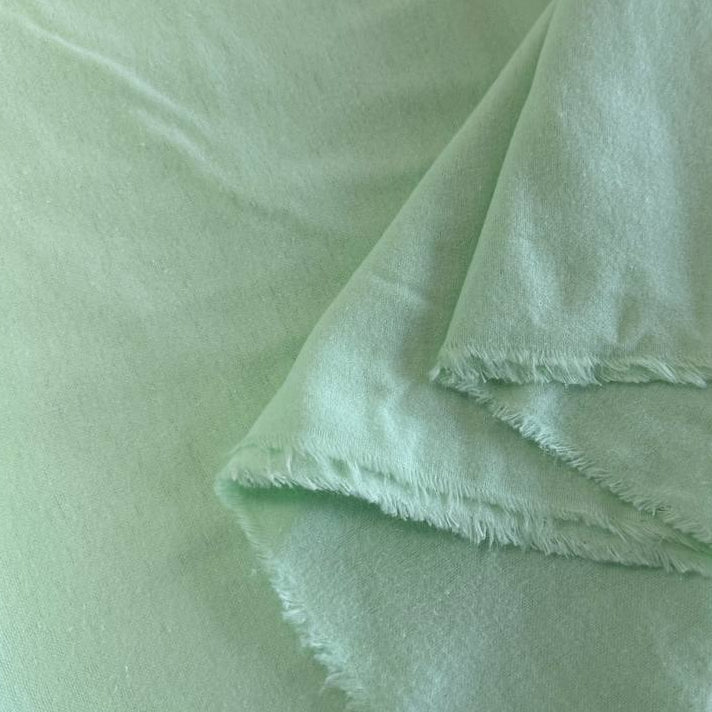 Soft 100% cotton flannelette fabric available in five solid colors: royal blue, pink, grey, mint, and white