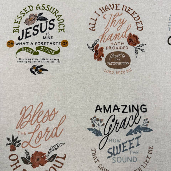 Wellspring Christian fabric panel by Fancy That Design House for Moda Fabrics featuring inspirational faith quotes and floral designs on a natural linen-look background.