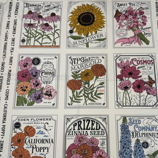 Moda My Secret Garden 100% cotton fabric panel by Stacy Iest Hsu featuring vintage flower seed packet illustrations on a cream background.