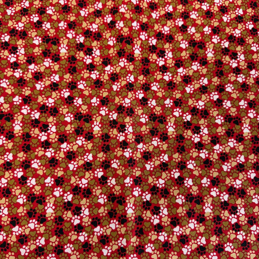 All-over paw print cotton fabric with a scattered animal footprint pattern.