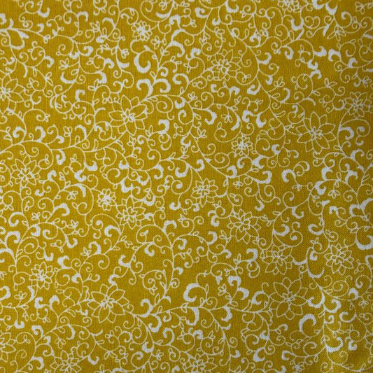 Quilting cotton fabric featuring an all-over floral vine and scrollwork pattern with delicate botanical details.