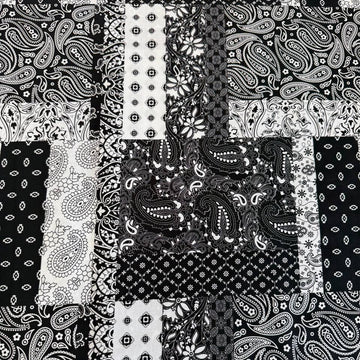 Quilting cotton fabric featuring a patchwork collage of paisley, floral, geometric, and bandana-inspired patterns arranged in contrasting blocks.