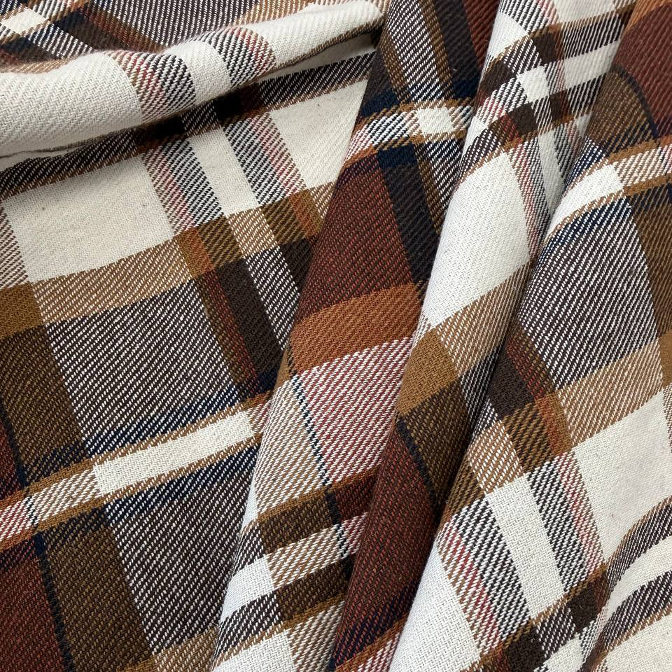 Cream, brown and rust double-sided plaid fabric, 65% polyester and 35% rayon