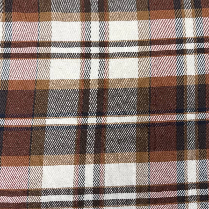 Cream, brown and rust double-sided plaid fabric, 65% polyester and 35% rayon