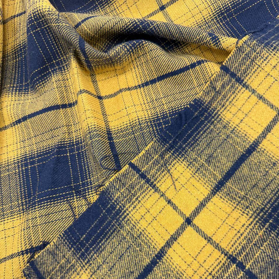 Mustard yellow and navy blue double-sided plaid fabric, 65% polyester and 35% rayon, 60 inches wide.