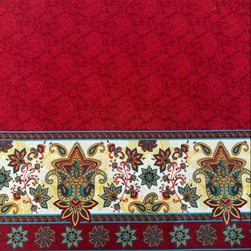 Red paisley fabric panel with decorative cream border featuring colorful floral and paisley motifs.
