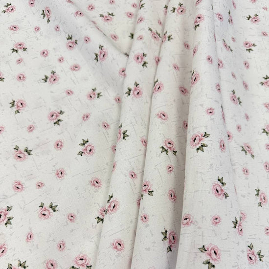 Hollie Rose 100% cotton fabric with small pink roses on a white background
