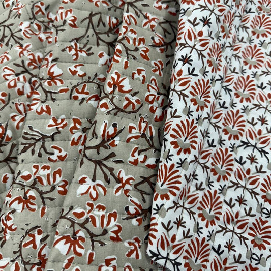 Double-sided quilted cotton fabric with coordinating brown rust and cream floral prints