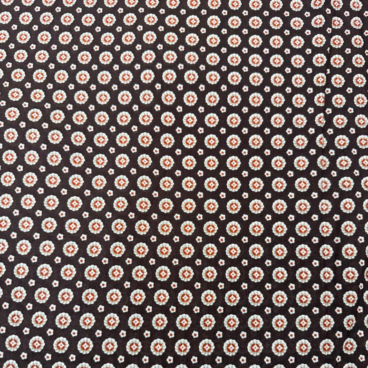 Lightweight brown 100% cotton fabric with small cream and rust geometric print