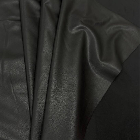 Soft PU Britney faux leather fabric with smooth PU leather-look front and soft suede-like backing, available in Black, Navy, Cognac and Sand.