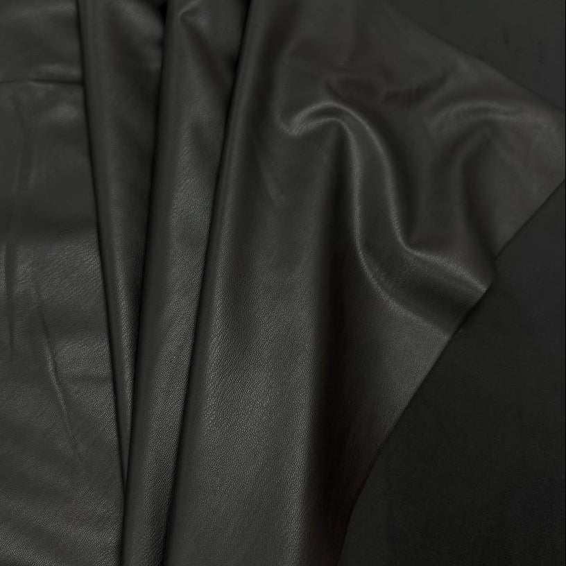 Soft PU Britney faux leather fabric with smooth PU leather-look front and soft suede-like backing, available in Black, Navy, Cognac and Sand.