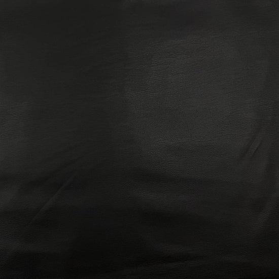Soft PU Britney faux leather fabric with smooth PU leather-look front and soft suede-like backing, available in Black, Navy, Cognac and Sand.