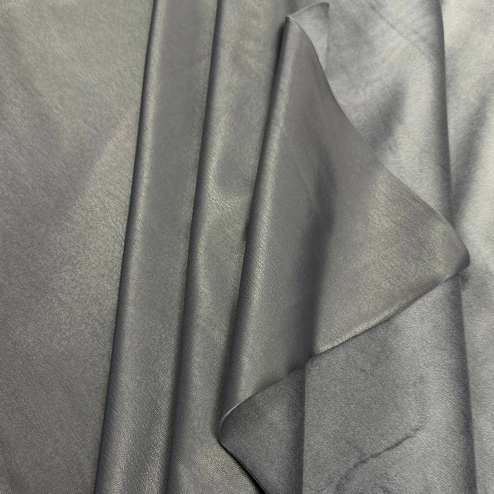 Soft PU Britney faux leather fabric with smooth PU leather-look front and soft suede-like backing, available in Black, Navy, Cognac and Sand.