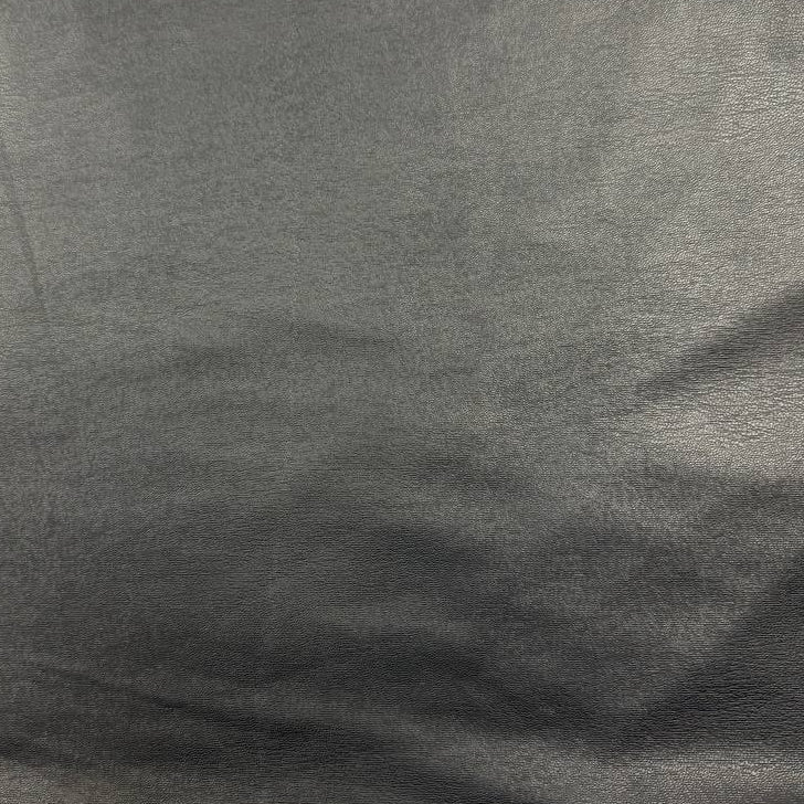 Soft PU Britney faux leather fabric with smooth PU leather-look front and soft suede-like backing, available in Black, Navy, Cognac and Sand.