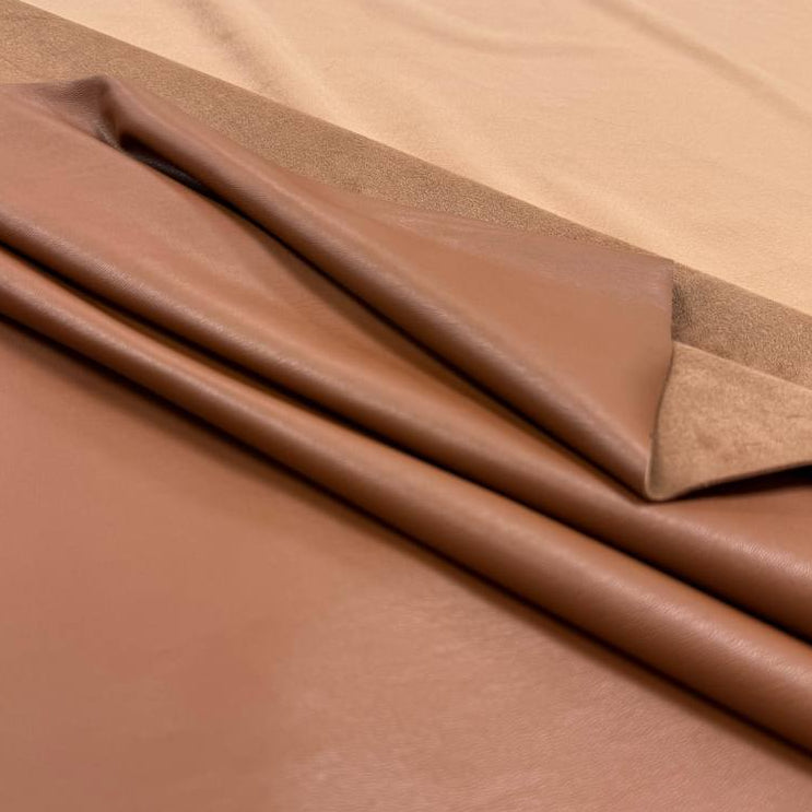 Soft PU Britney faux leather fabric with smooth PU leather-look front and soft suede-like backing, available in Black, Navy, Cognac and Sand.