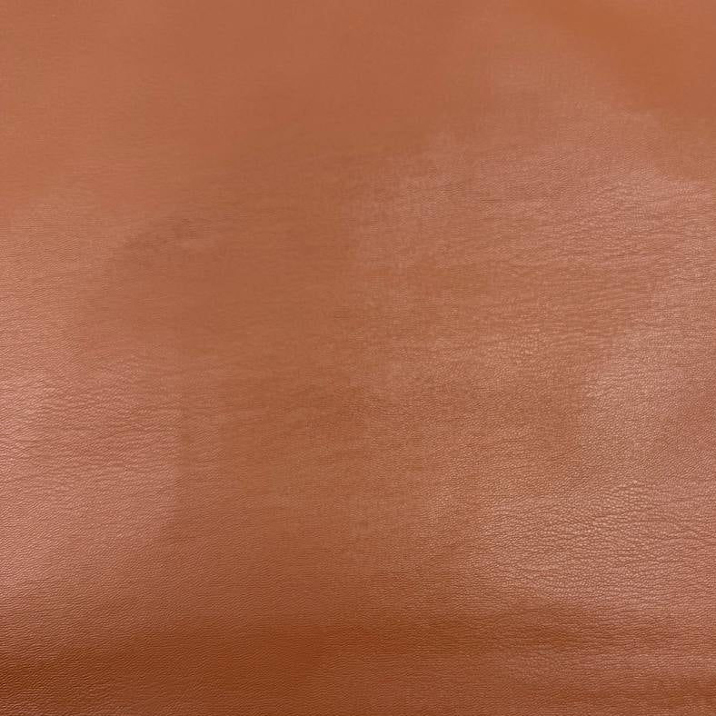 Soft PU Britney faux leather fabric with smooth PU leather-look front and soft suede-like backing, available in Black, Navy, Cognac and Sand.