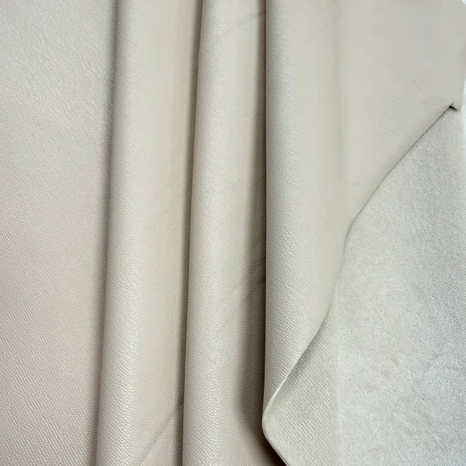 Soft PU Britney faux leather fabric with smooth PU leather-look front and soft suede-like backing, available in Black, Navy, Cognac and Sand.