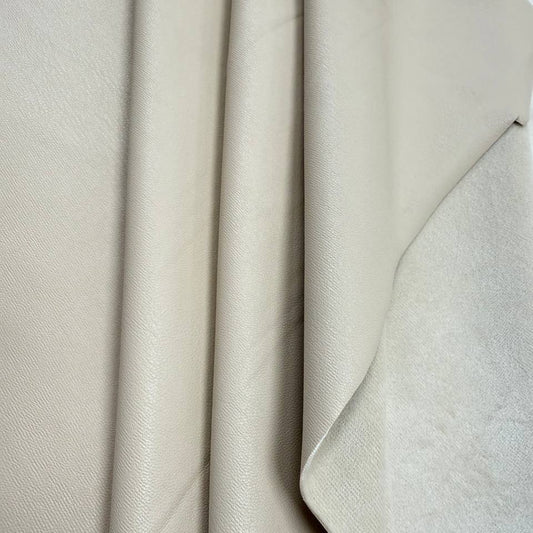 Soft PU Britney faux leather fabric with smooth PU leather-look front and soft suede-like backing, available in Black, Navy, Cognac and Sand.