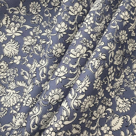 Blue 100% cotton twill fabric with an intricate ivory floral and botanical print.