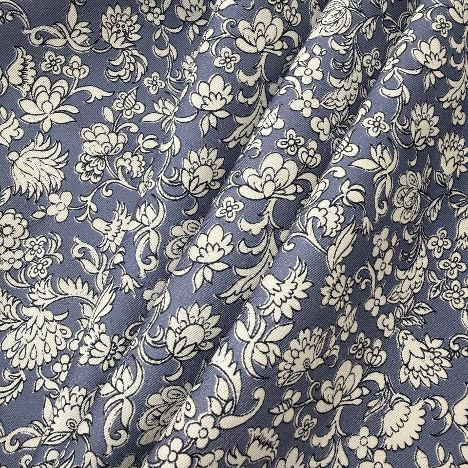 Blue 100% cotton twill fabric with an intricate ivory floral and botanical print.