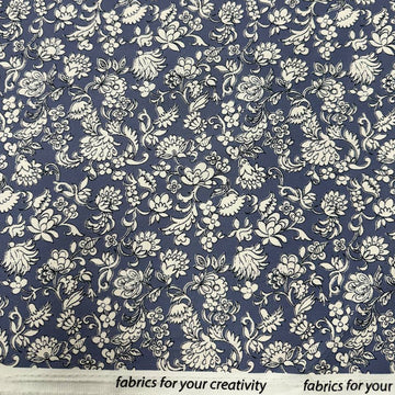 Blue 100% cotton twill fabric with an intricate ivory floral and botanical print.