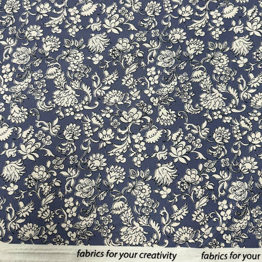Blue 100% cotton twill fabric with an intricate ivory floral and botanical print.