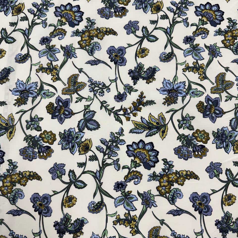 Lightweight 100% cotton poplin fabric with blue, green and mustard floral paisley print on a cream background.