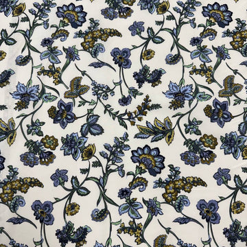 Lightweight 100% cotton poplin fabric with blue, green and mustard floral paisley print on a cream background.