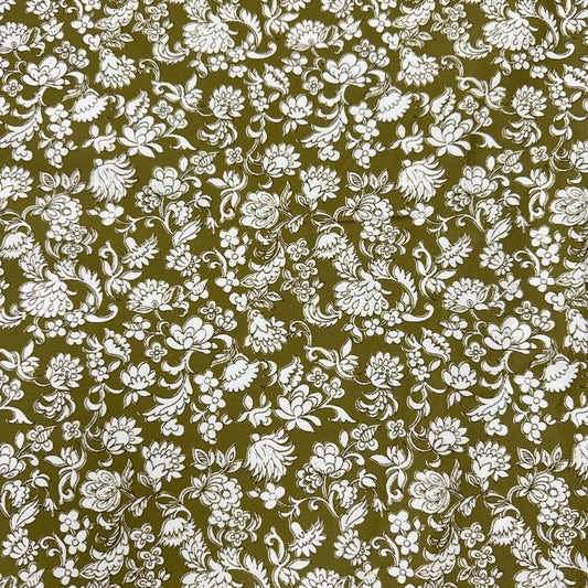 Olive green 100% cotton twill fabric with an intricate white floral and botanical print.