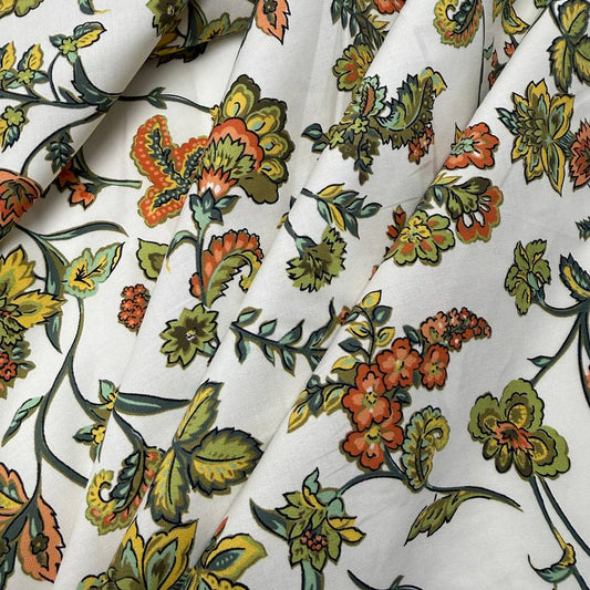 Lightweight 100% cotton poplin fabric with colourful paisley floral print on a white background.