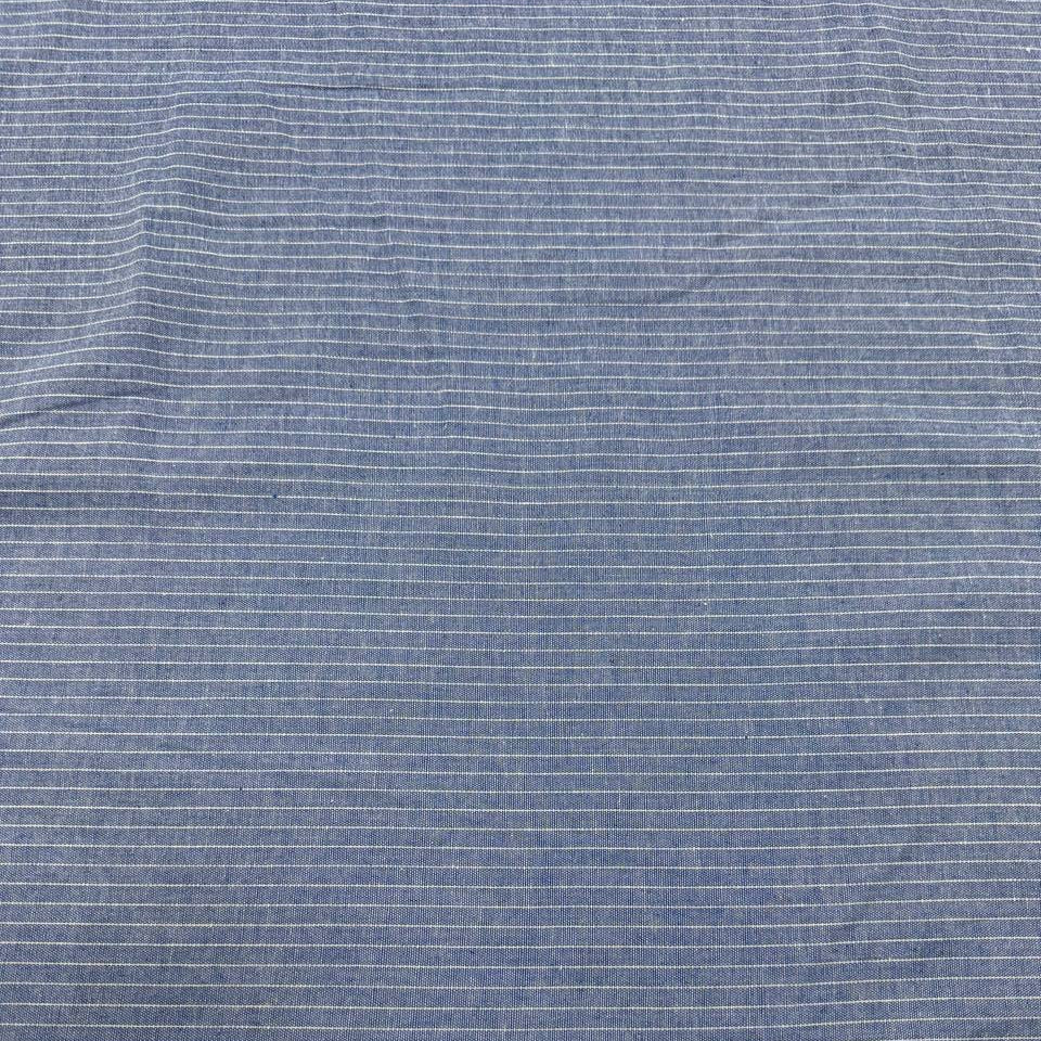 Blue pinstripe denim fabric with fine white stripes, 65% cotton and 35% polyester, 150 cm wide.