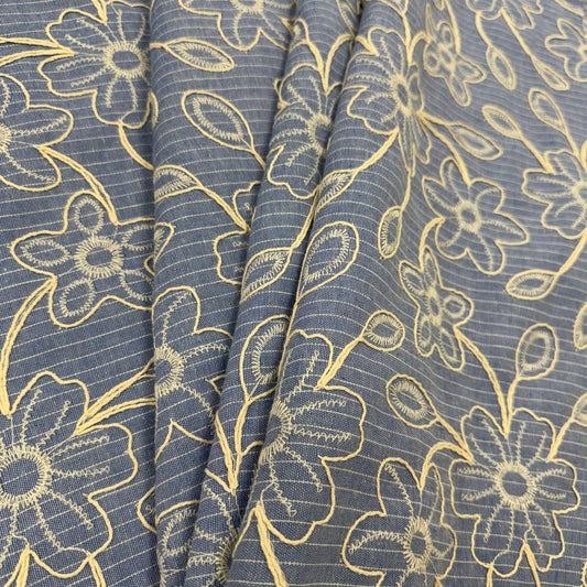 Denim blue pinstripe fabric with cream floral embroidery, 35% cotton and 65% polyester, 150 cm wide