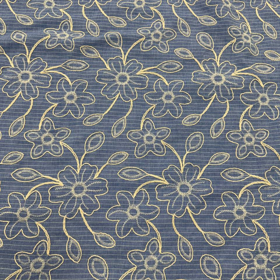 Denim blue pinstripe fabric with cream floral embroidery, 35% cotton and 65% polyester, 150 cm wide